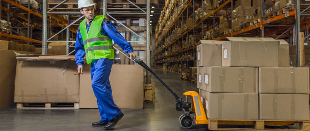 Warehouse Employee Pulling Boxes on Truck