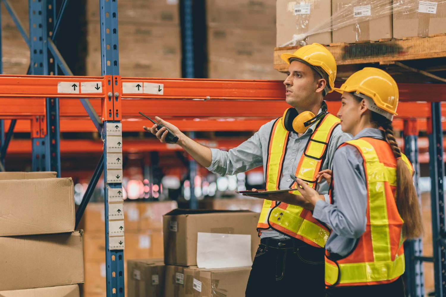 Warehouse Worker Using Pallet Trolley